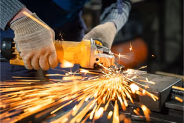 Power tool in use with sparks flying