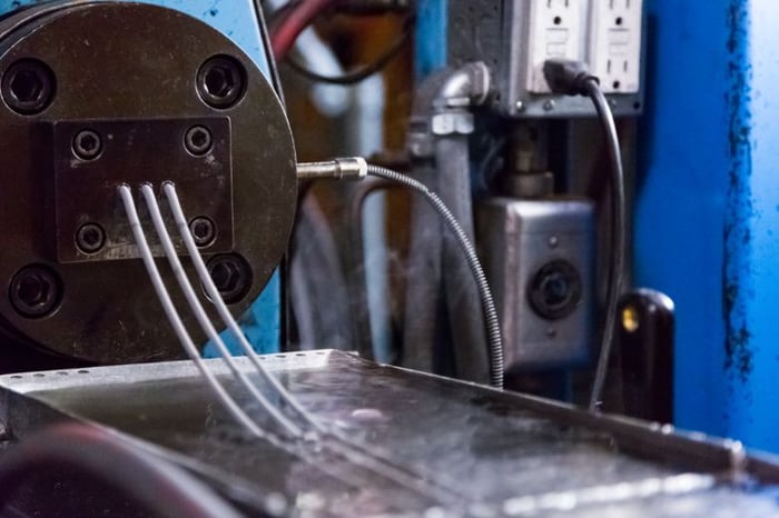 Feedstock coming out of MIM machine